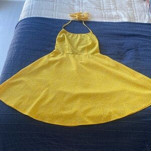 Fun and flirty yellow and white backless summer dress, with adjustable strings.